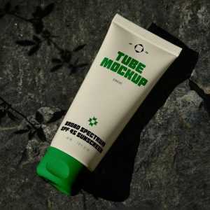 Free Lying on Rock Cosmetic Tube Mockup