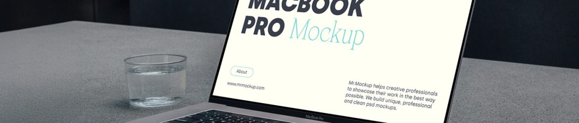 Free MacBook Pro Laying On Concrete Mockup