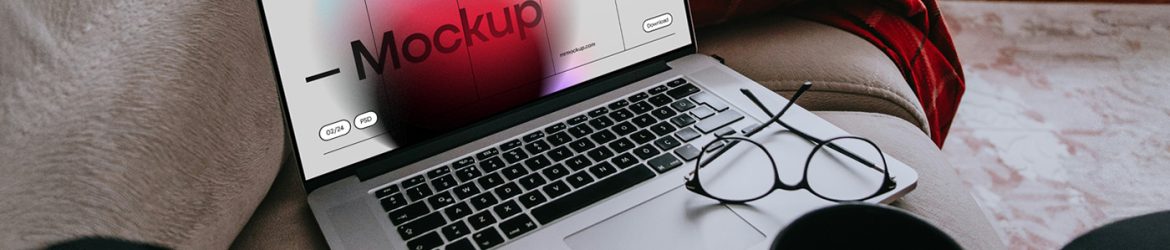Free MacBook Pro Laying on Couch Mockup