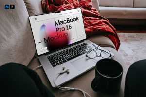 Free MacBook Pro Laying on Couch Mockup