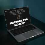 Free MacBook Pro on Black Table Mockup