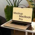 Free MacBook Pro on Small Table Mockup