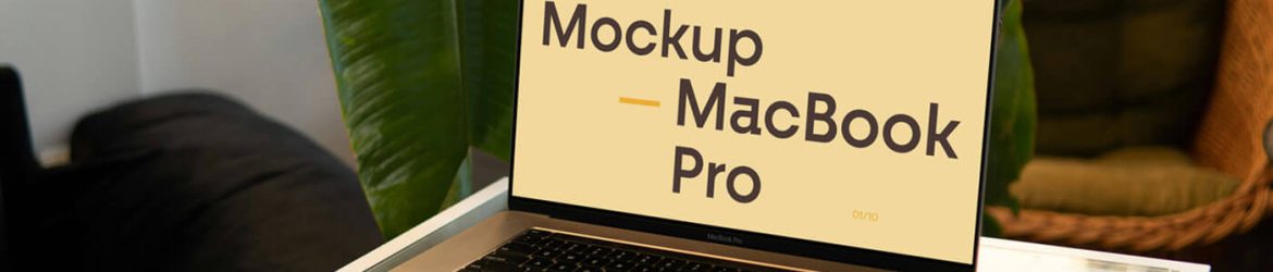 Free MacBook Pro On Small Table Mockup PSD