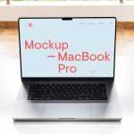 Free MacBook Pro on White Table Mockup