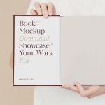 Free Open Book Holding by Man Mockup