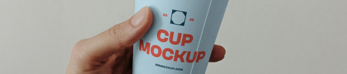 Free Paper Coffee Cup in Hand Mockup