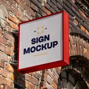 Free Sign Attached to Wall Mockup