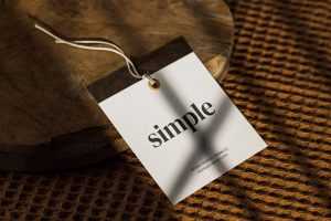Free Square Clothing Label Hang Tag Mockup Shadow Overlay