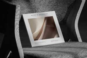 Free Square Magazine Cover Mockup on Textured Fabric Chair