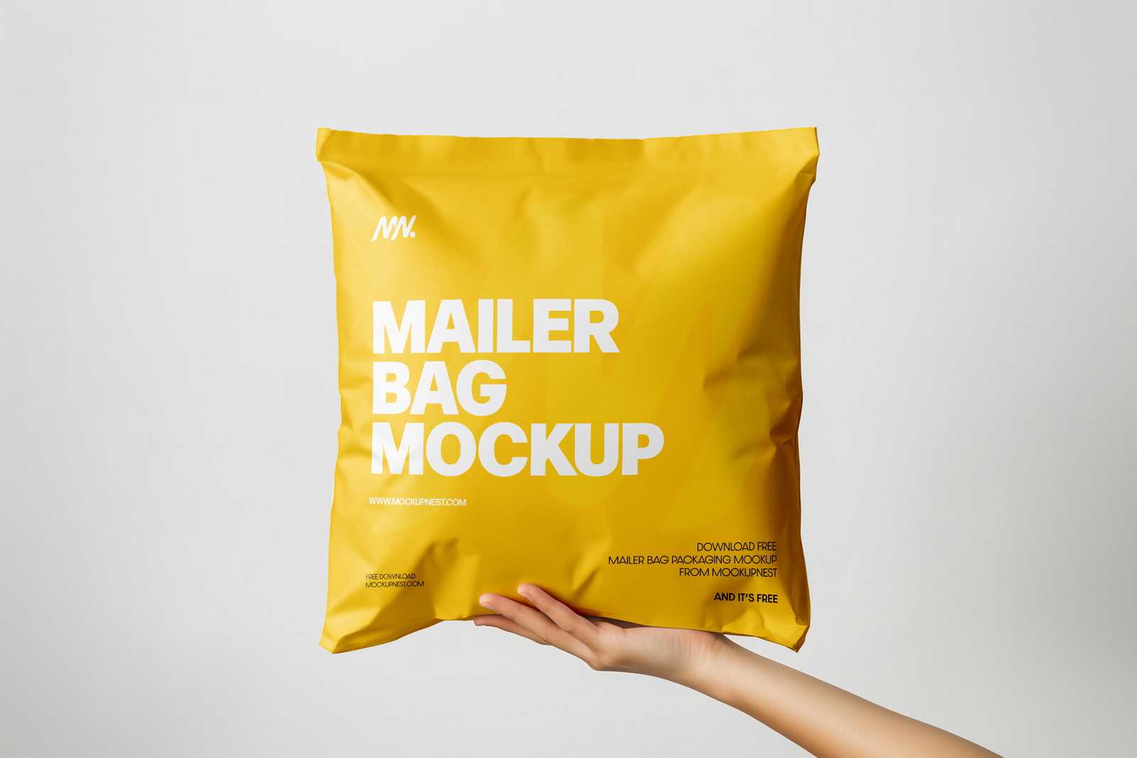 Free Square Paper Mailer Bag Mockup Holding By Hand