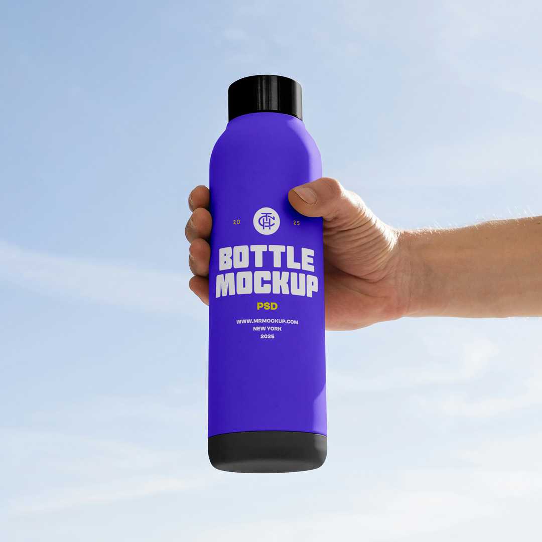 Free Tall Bottle in Hand Mockup