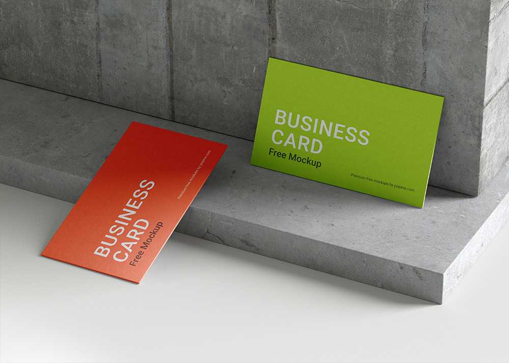Free Two Business Cards Mockup on Textured Concrete Wall