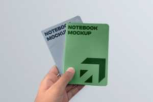 Free Two Notebook in Hand Mockups