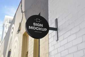 Free Wall-Mounted Round Shop Sign Mockup PSD