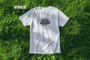 Free White T-Shirt On Grass Mockup PSD