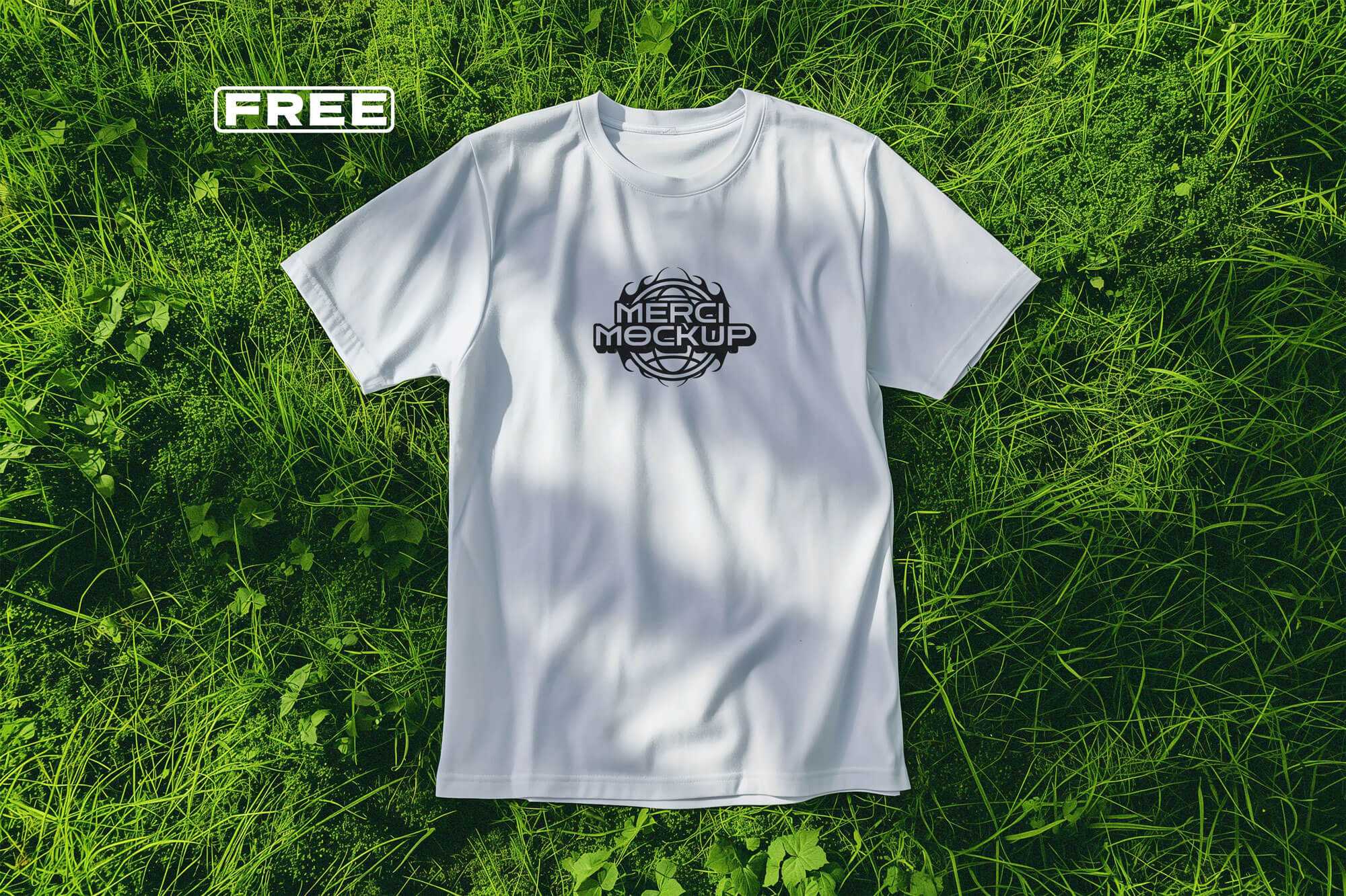 Free White T-Shirt On Grass Mockup PSD