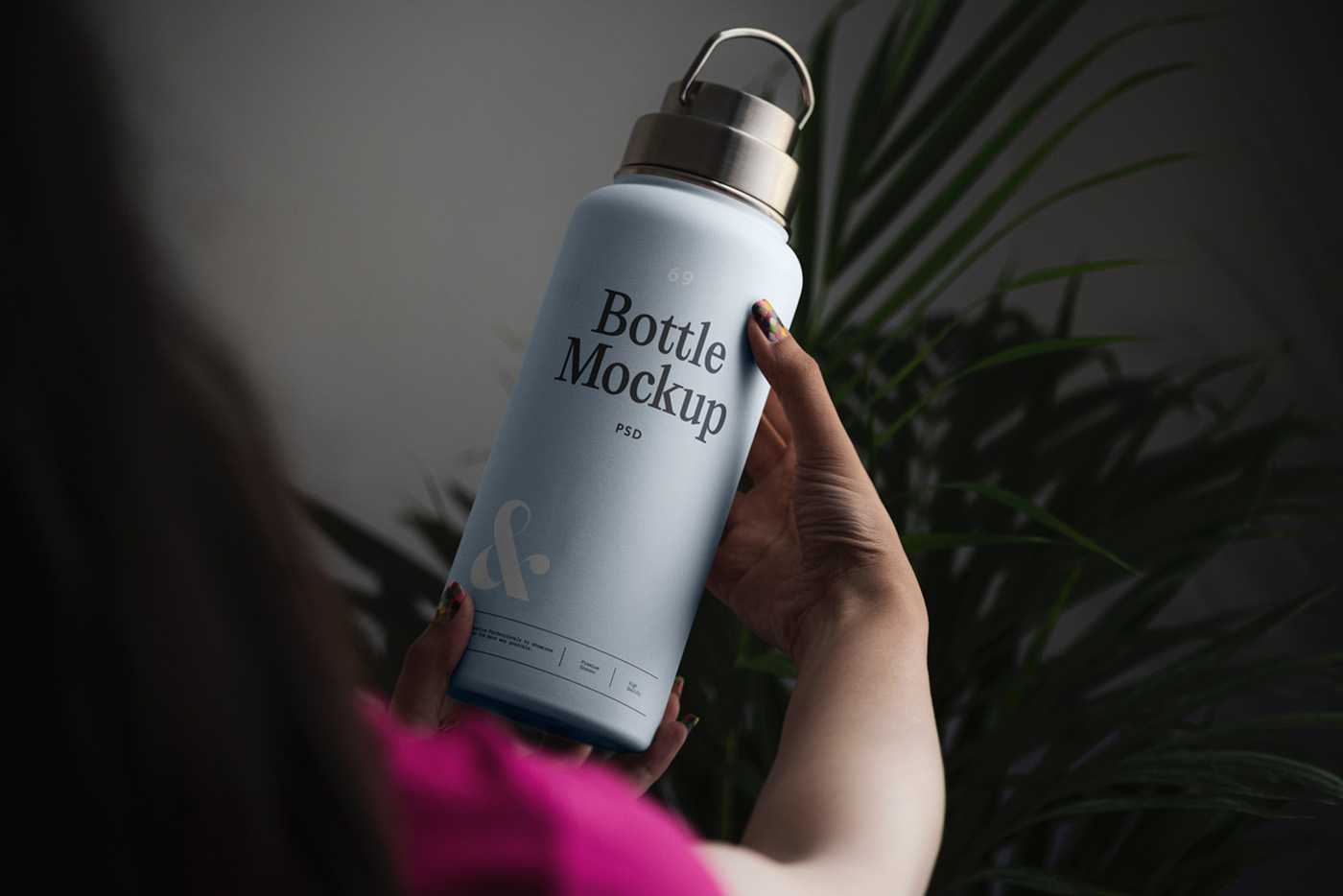 Free Woman Holding Bottle Mockup