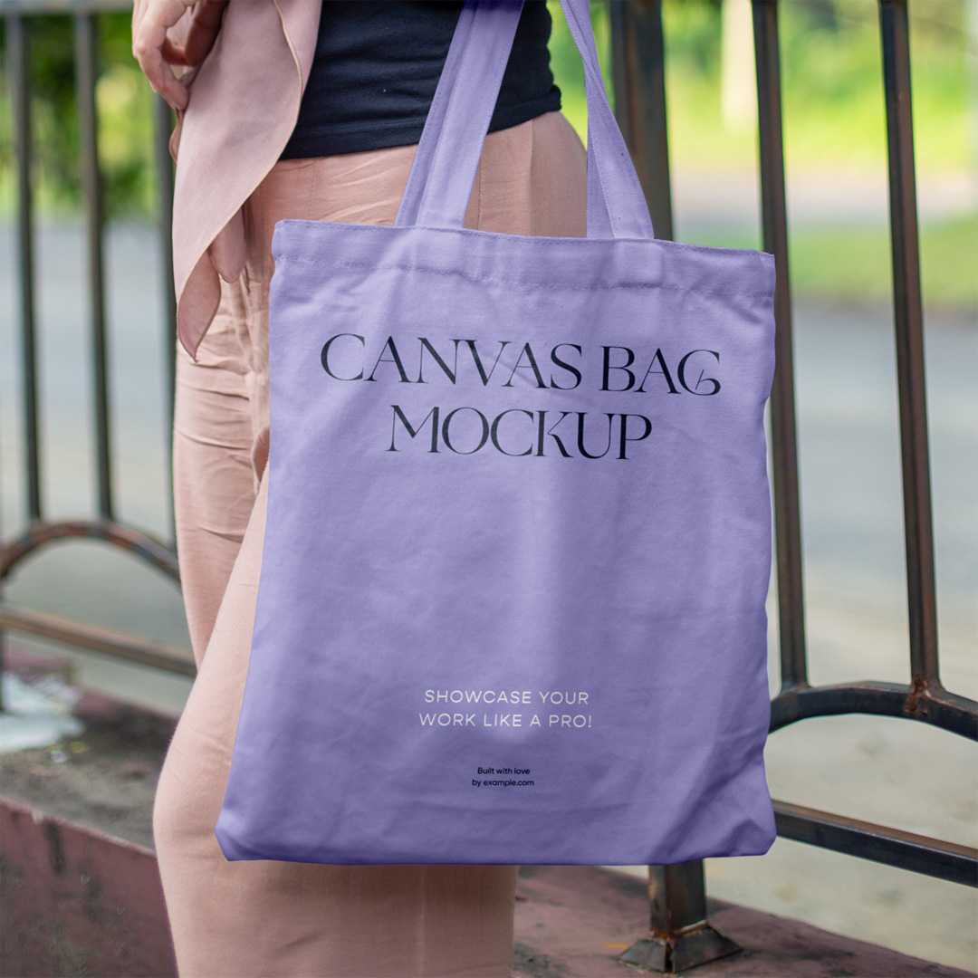 Free Woman in Park Holding Canvas Bag Mockup