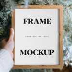 Free Wooden Photo Frame Mockup in Hand - Free PSD Download Free Wooden Photo Frame Mockup in Hand