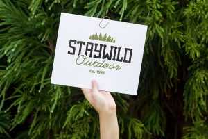 Free Xmas Greetings Card in Hand Mockup PSD