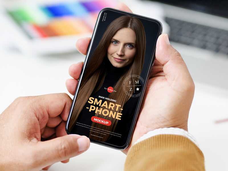 Hand holding Free Smartphone Mockup PSD