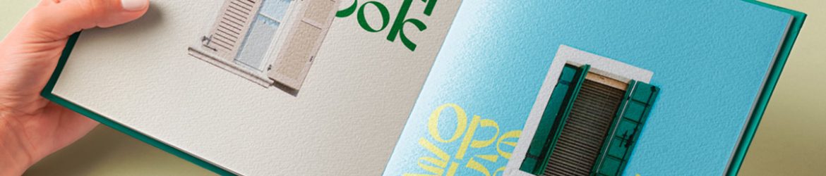 Hand Holding Hardcover Open Book Mockup PSD