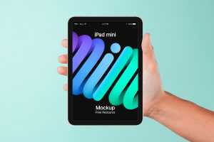 Hand Holding iPad mini Mockup PSD for Free