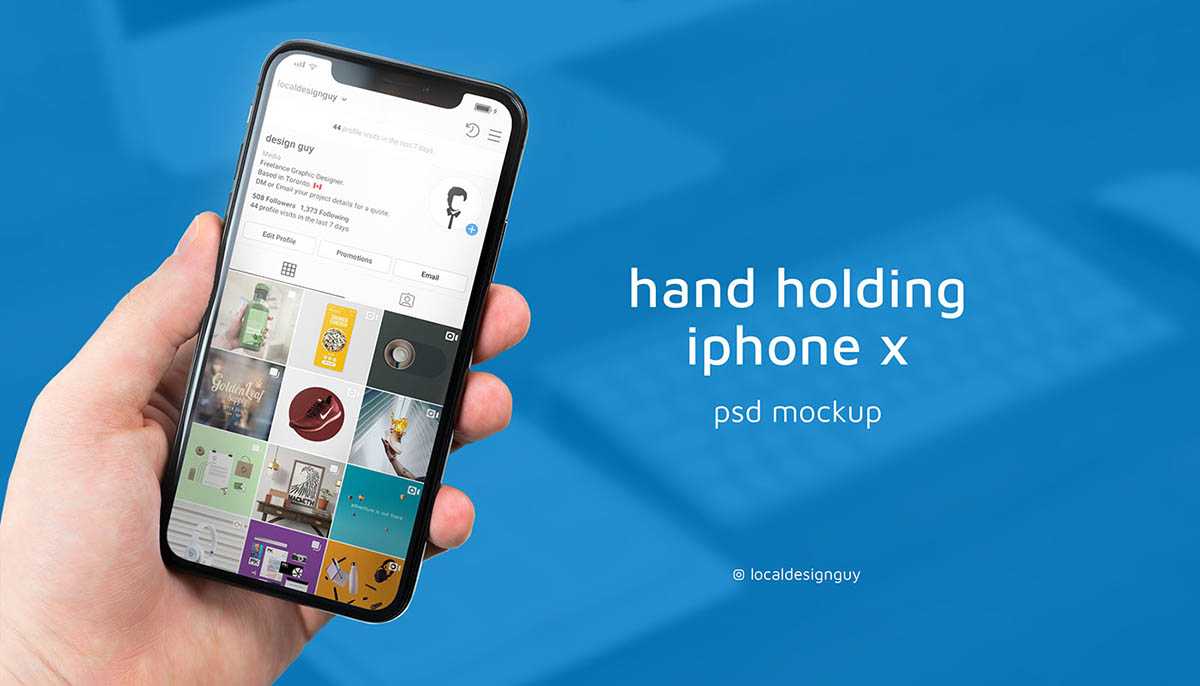 Hand holding iPhone X indoors Mockup PSD