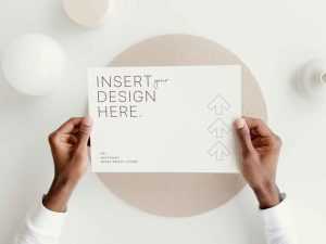 Hand Holding Landscape Letter Free Mockup PSD