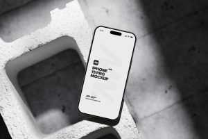Iphone 15 Pro On Concrete Brick Mockup
