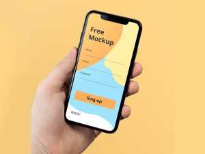iPhone X in Hand Free PSD Mockup