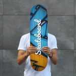 Man Holding Skateboard Mockup PSD free