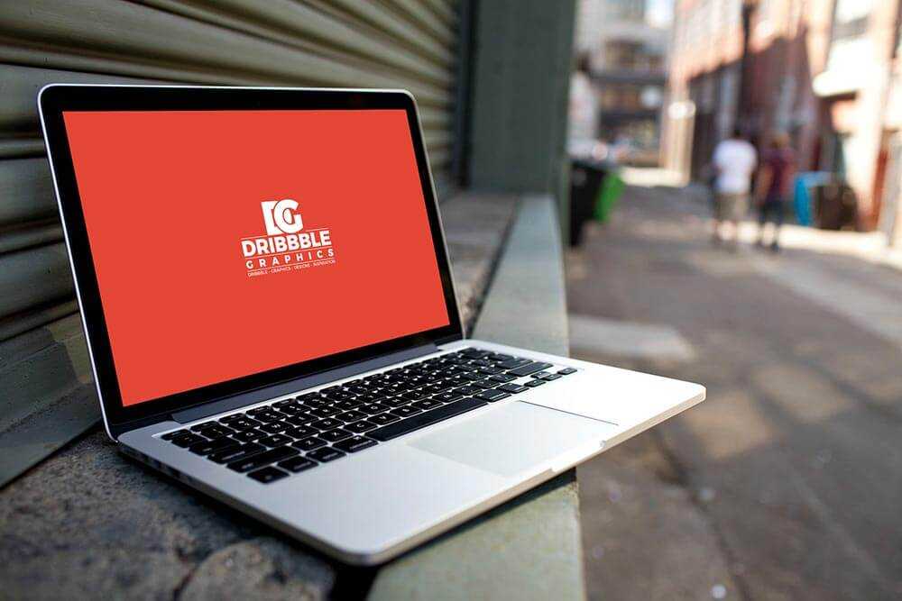 Open Laptop Mockup PSD on in Front of Street Shop Free PSD