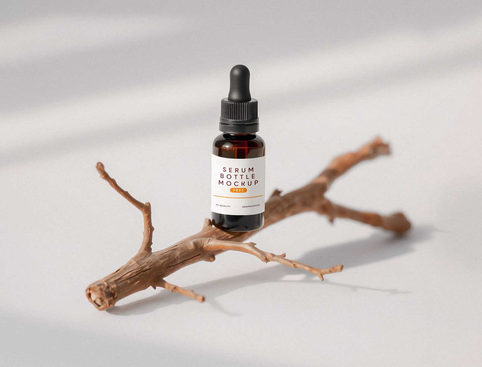 A Glass Serum Bottle Mockup On A Little Twig