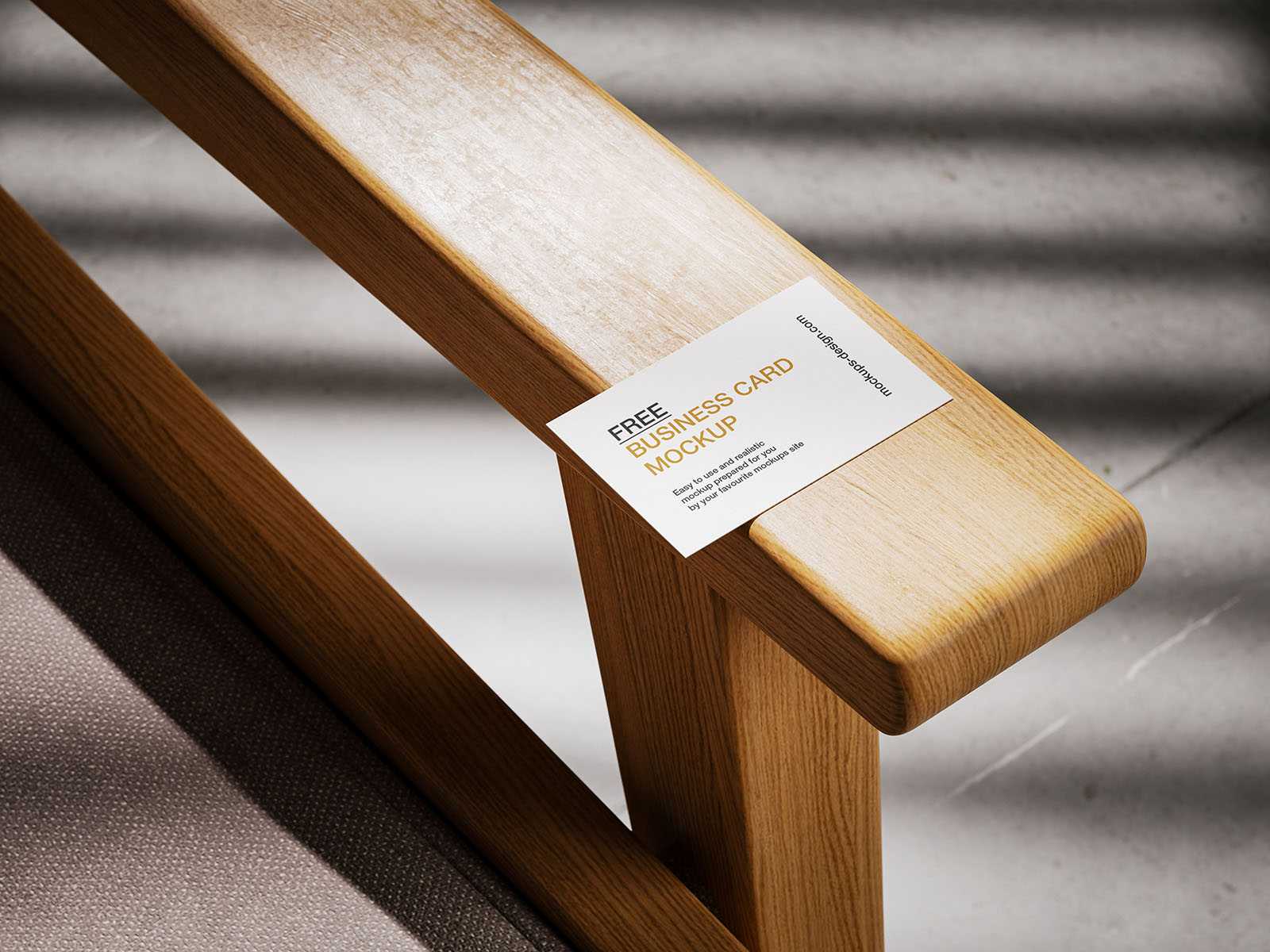 Business card lying on armchair mockup