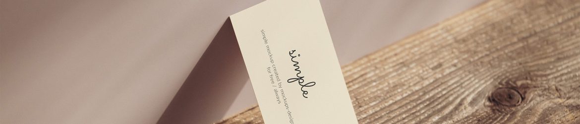 Business card lying on the wall mockup