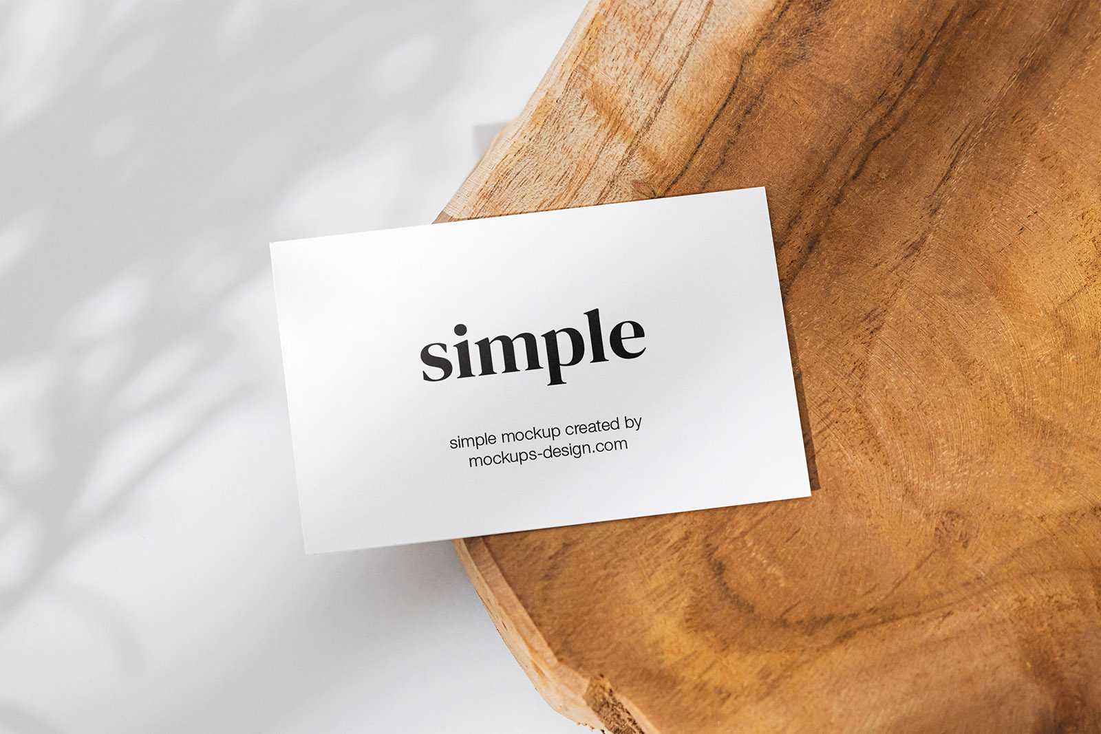 Business card on a slice of wood mockup