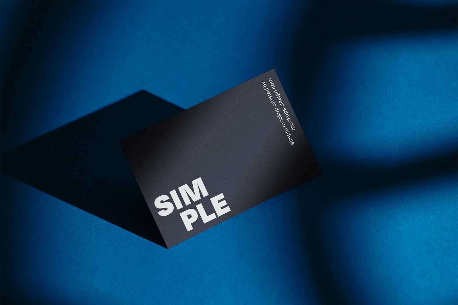 Business card on blue background mockup