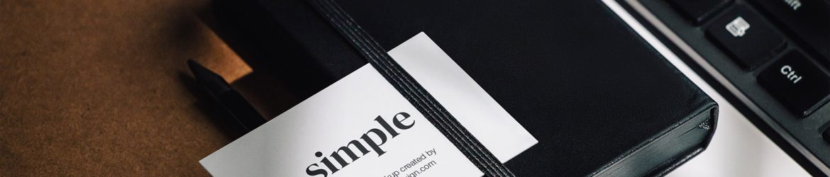 Business card on the black notepad Business card on the black notepad