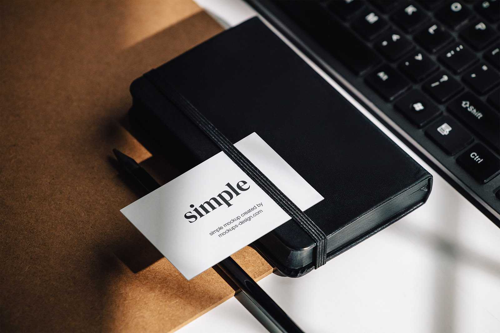 Business card on the black notepad