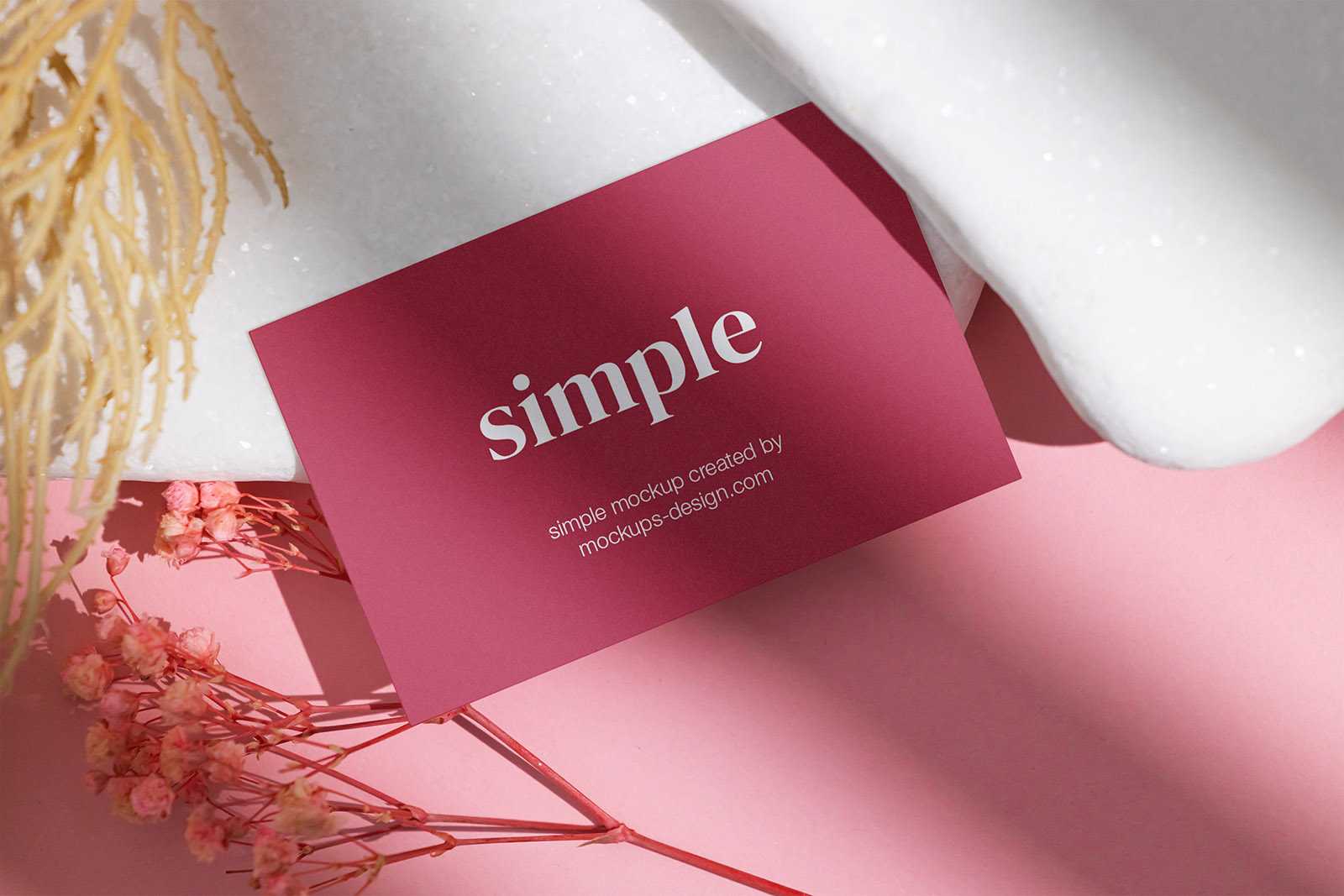 Business card on white stones mockup