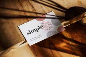 Business card on wooden table mockup