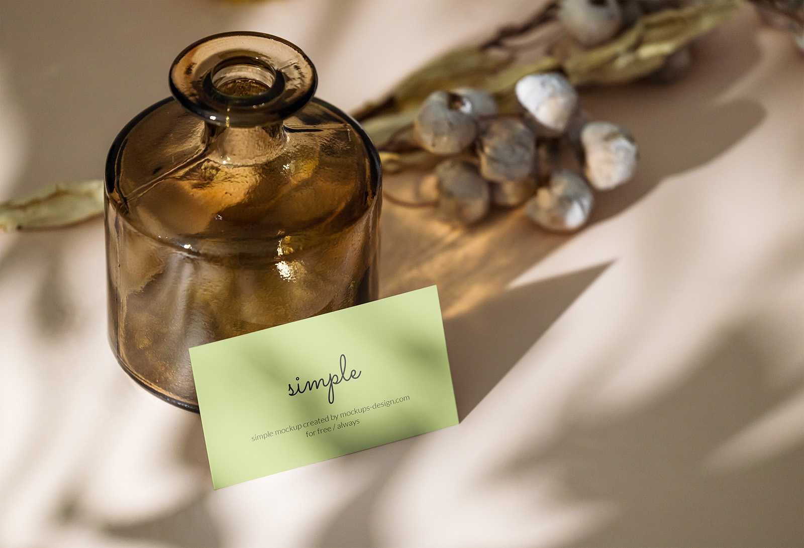 Business card with dark bottle mockup
