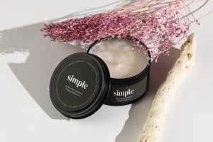 Candle in tin jar on light background mockup