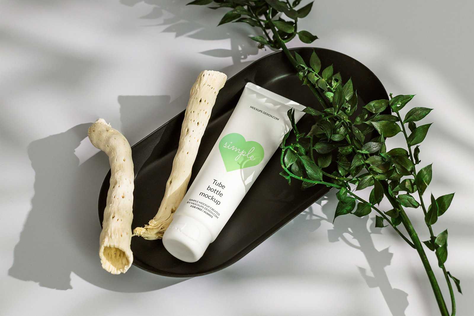 Cosmetic tube in black tray mockup