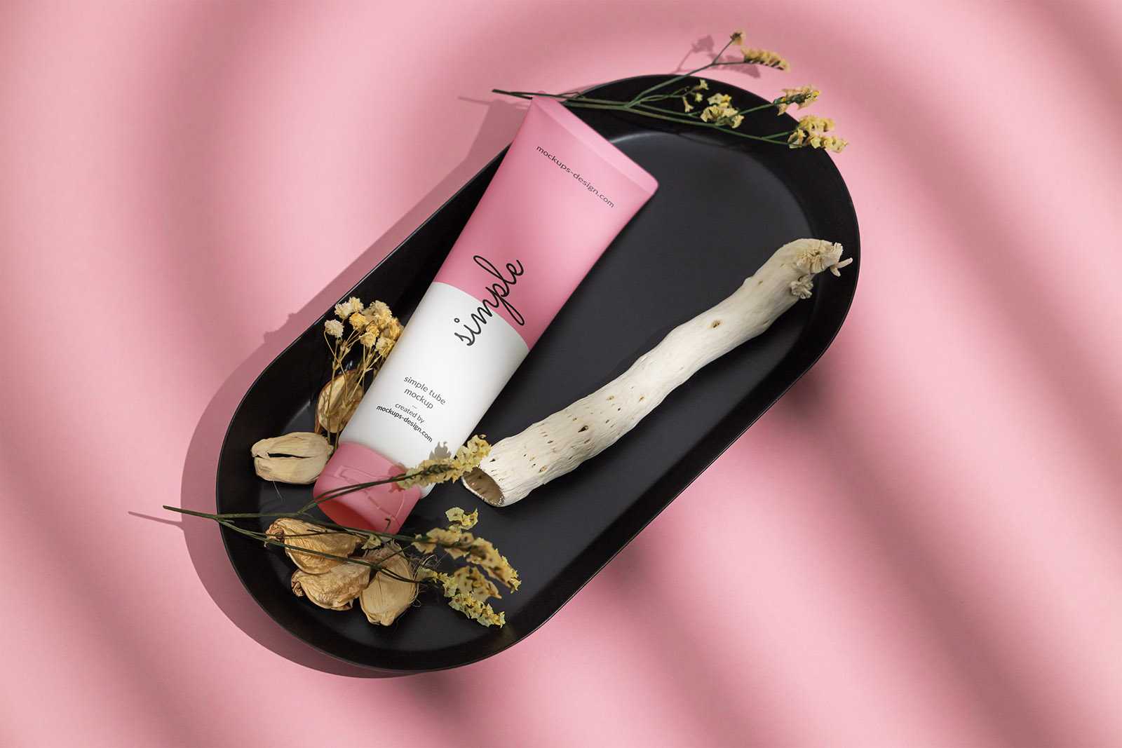 Cosmetic tube on black tray mockup