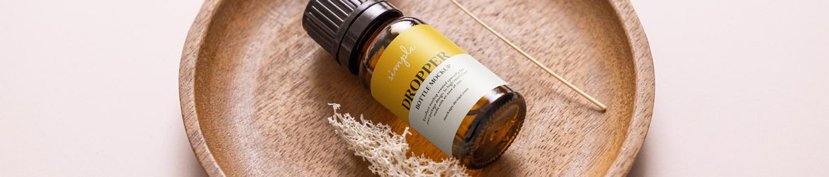 Essential oil bottle in the bowl mockup Essential oil bottle in the bowl mockup
