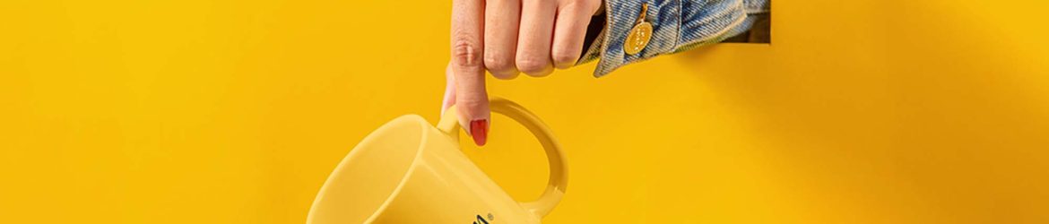 Free Cup with Hand Mockup (PSD)