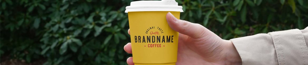Free Hand Holding Coffee Cup Mockup (PSD)