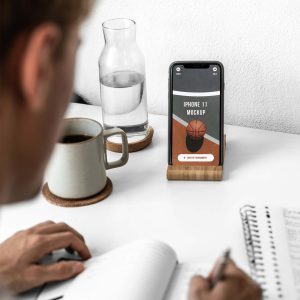 Free iPhone 11 on Holder Mockup (PSD)